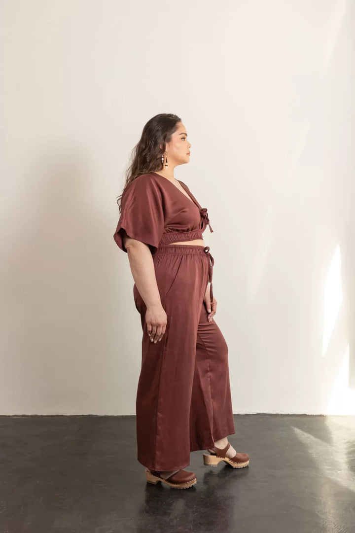 Friday Pattern Co. Saguaro Set sewing pattern featuring flowy pants with pockets and a reversible V-neck pullover top, sizes XS–7X.
