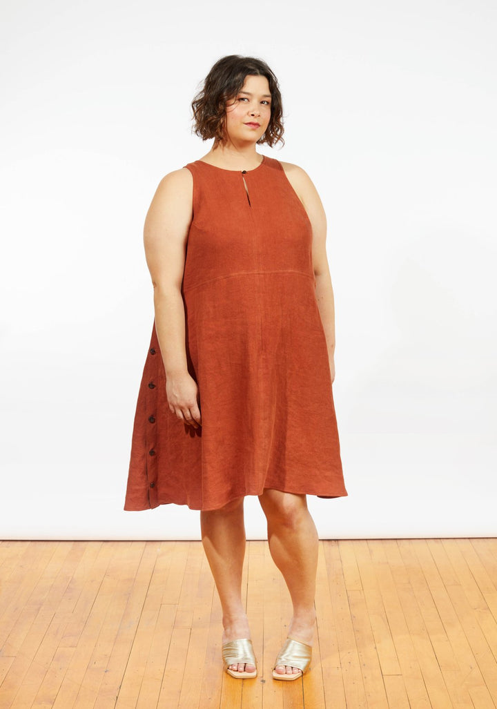Grainline Studio Austin Dress sewing pattern for sizes 14–32 with sleeveless design, side button closures, and customizable skirt options