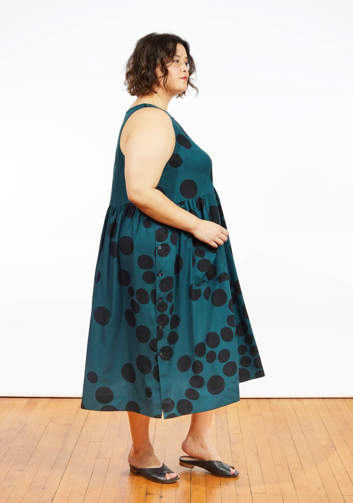 Grainline Studio Austin Dress sewing pattern for sizes 14–32 with sleeveless design, side button closures, and customizable skirt options