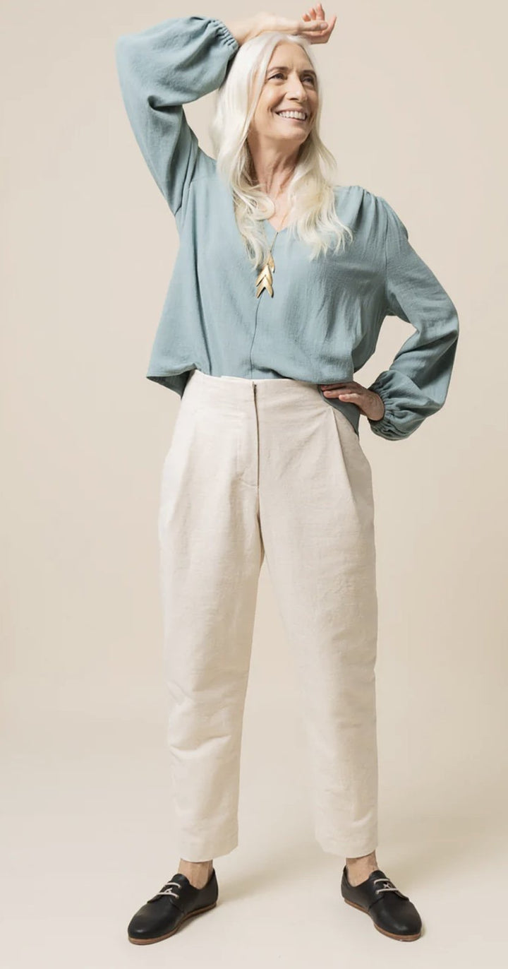 Create elegant, high-waisted pleated trousers with the Closet Core Mitchell Pattern. Featuring deep front pleats, angled pockets, tapered or wide-leg options, and optional waist tie, this sewing pattern is perfect for polished everyday wear.