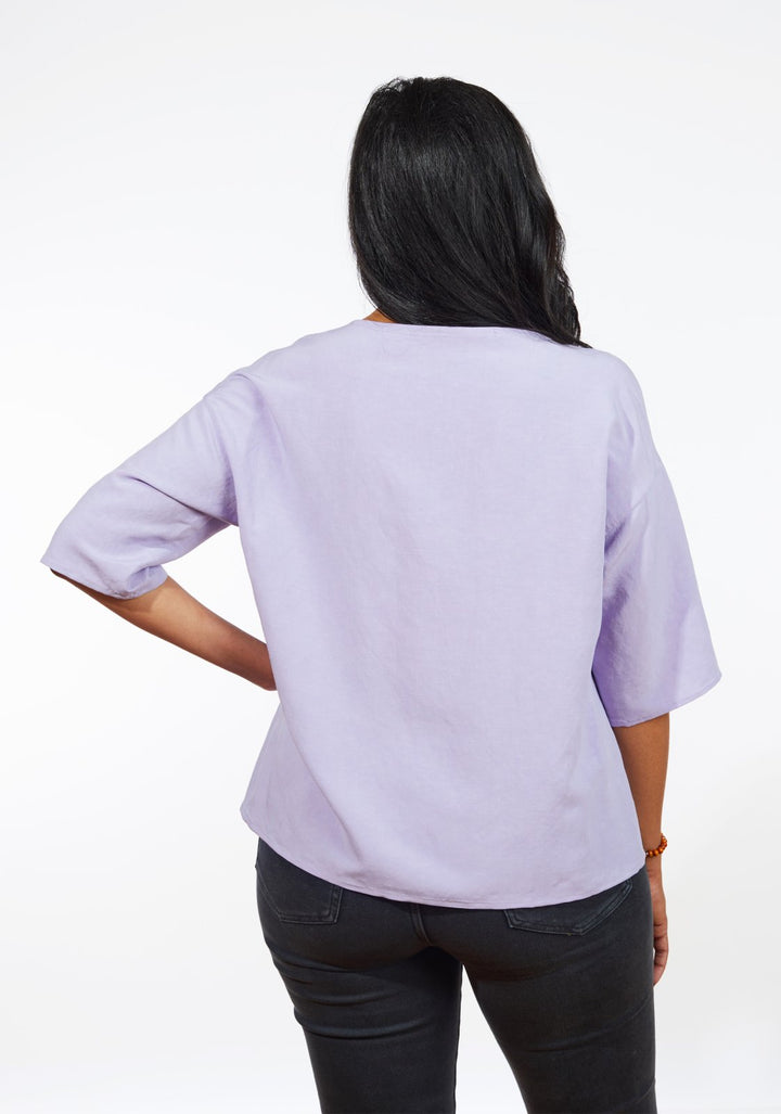 Grainline Studio Corbin Top sewing pattern for sizes 0–18, featuring ruffled cap and 3/4-length sleeve options.