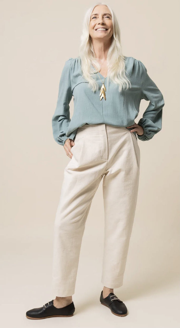 Create elegant, high-waisted pleated trousers with the Closet Core Mitchell Pattern. Featuring deep front pleats, angled pockets, tapered or wide-leg options, and optional waist tie, this sewing pattern is perfect for polished everyday wear.