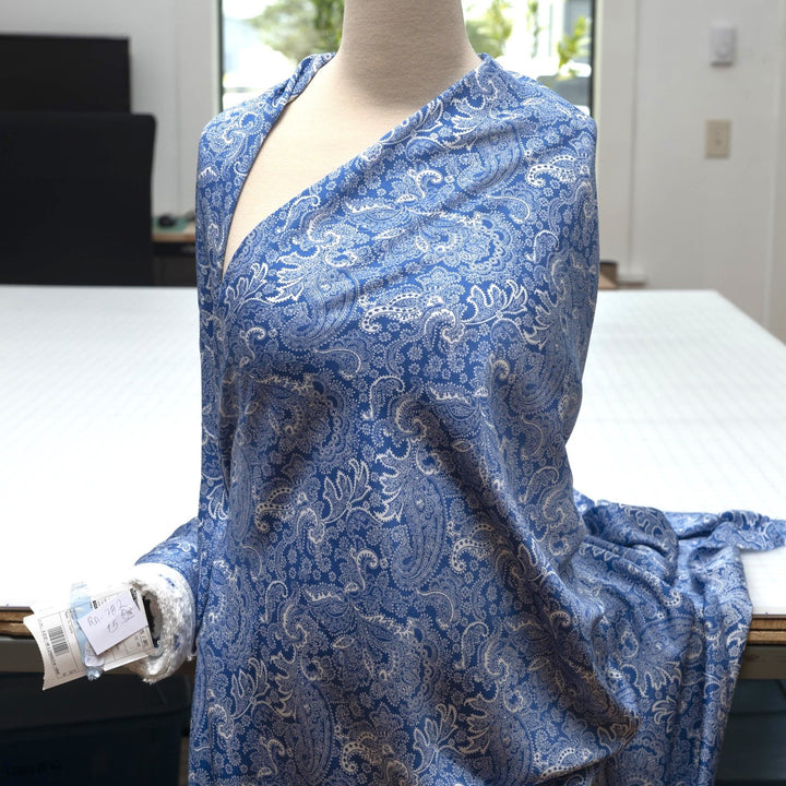 Viscose Twill fabric in cobalt blue and white paisley print, lightweight and silk-like for dressmaking