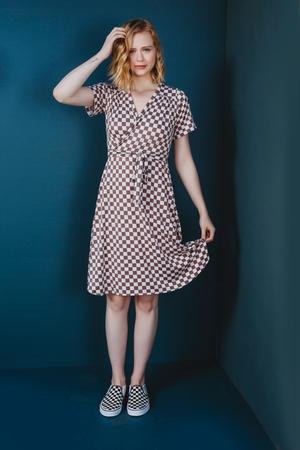 Friday Pattern Co. Westcliff Dress sewing pattern with faux wrap front, A-line skirt, optional gathered tier, tie belt, and sizes XS–4X