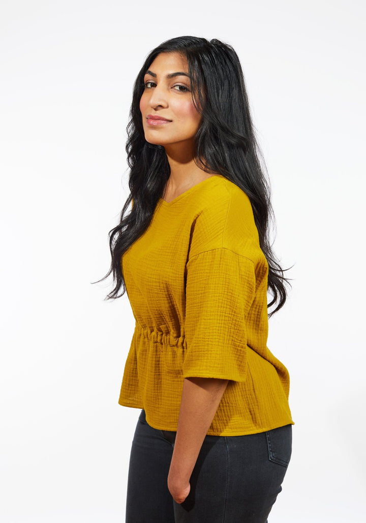 Grainline Studio Corbin Top sewing pattern for sizes 0–18, featuring ruffled cap and 3/4-length sleeve options.