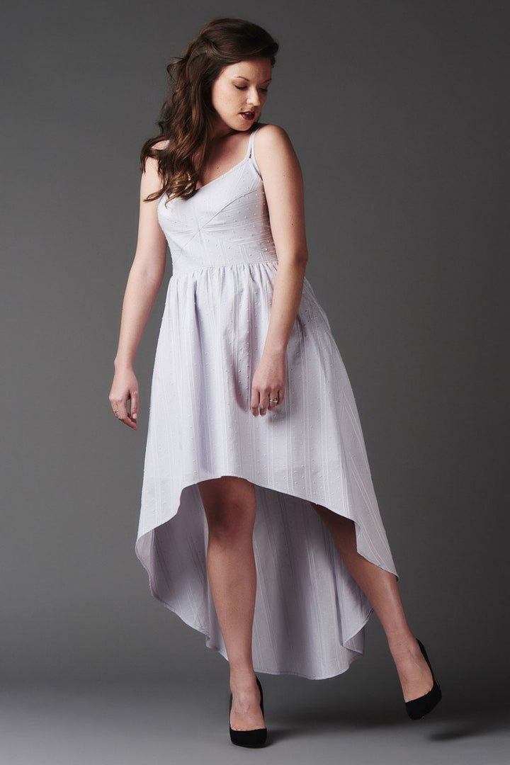 Deer and Doe Centauree Dress sewing pattern with double straps, geometric paneled bodice, above-knee or high-low hem, sizes 34–46