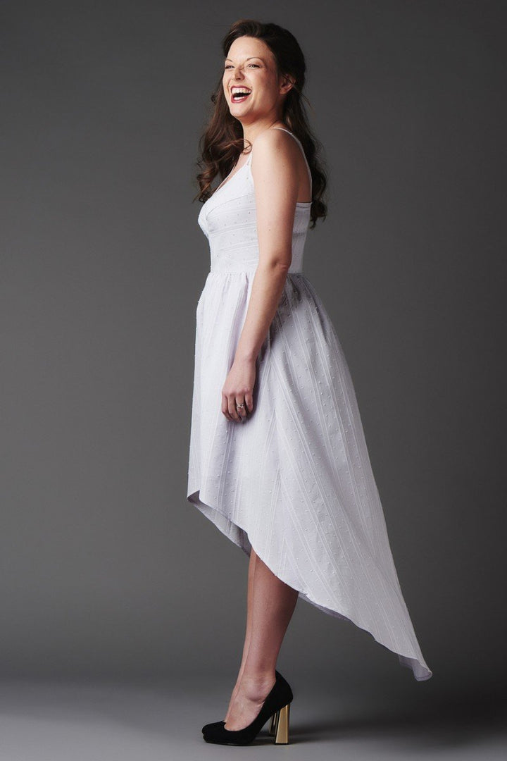 Deer and Doe Centauree Dress sewing pattern with double straps, geometric paneled bodice, above-knee or high-low hem, sizes 34–46