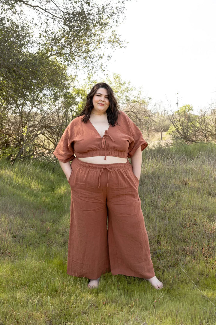 Friday Pattern Co. Saguaro Set sewing pattern featuring flowy pants with pockets and a reversible V-neck pullover top, sizes XS–7X.