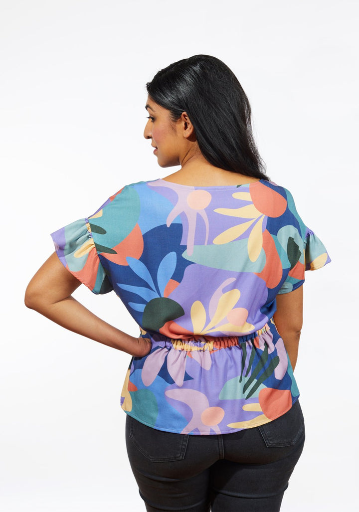 Grainline Studio Corbin Top sewing pattern for sizes 0–18, featuring ruffled cap and 3/4-length sleeve options.