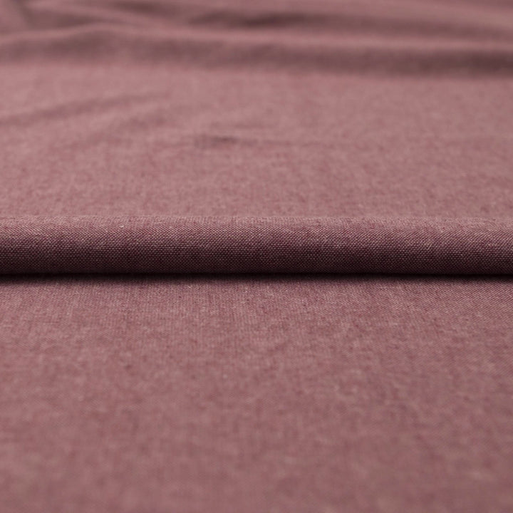 Close-up of Linen/Rayon Yarn Dye fabric in plum color showing textured yarn-dyed pattern and rich color variation.