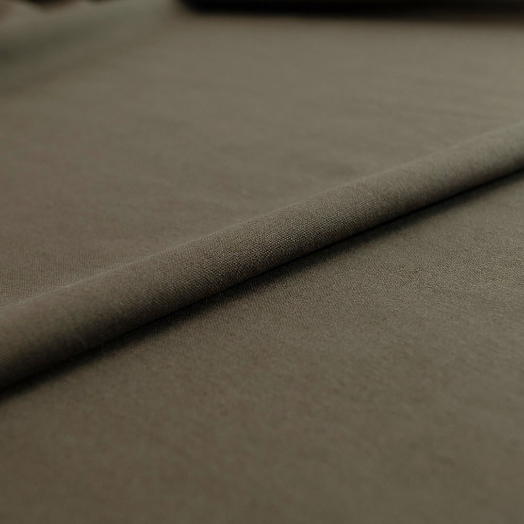 Olive green laundered linen fabric, pre-washed for softness and elegant drape


