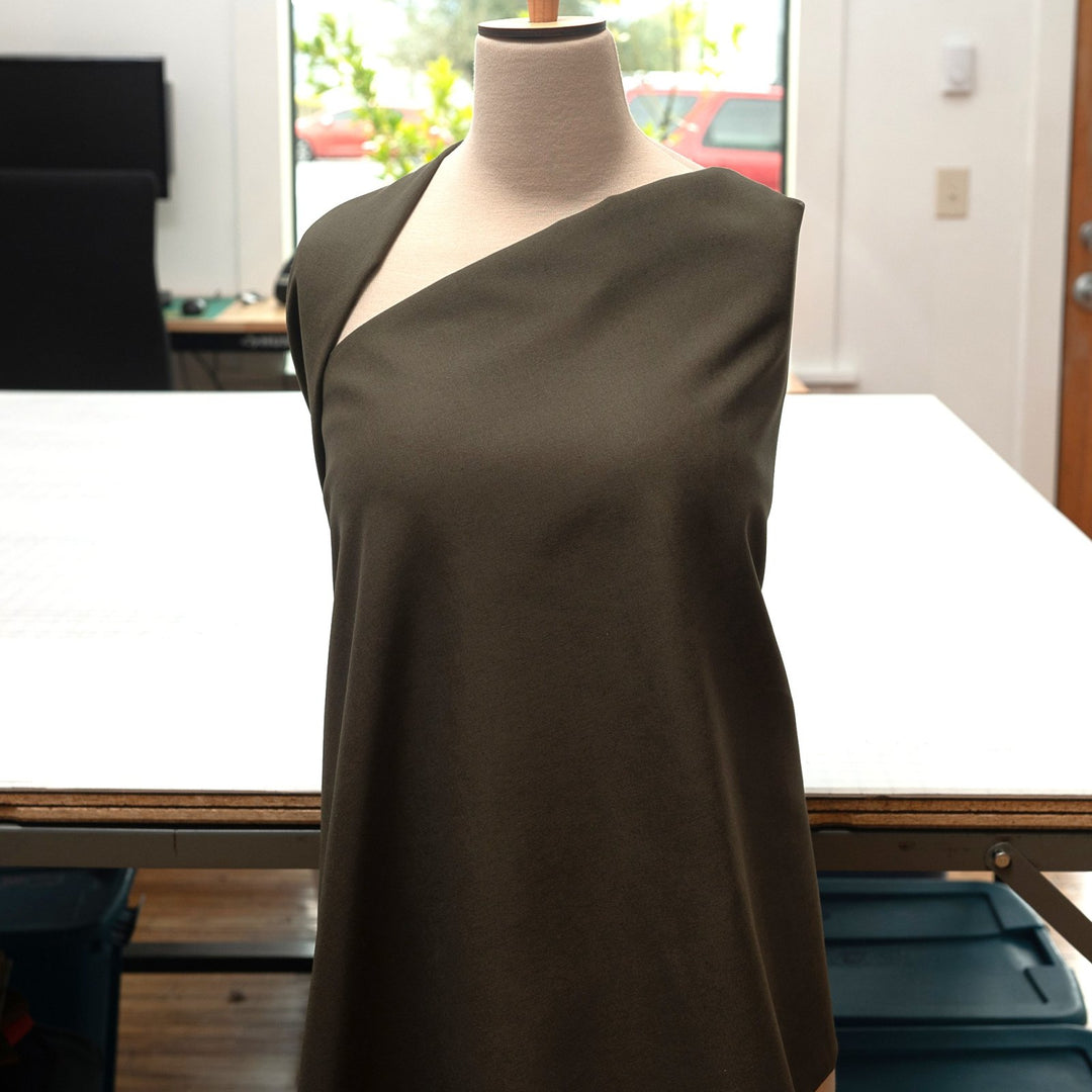 Olive green laundered linen fabric, pre-washed for softness and elegant drape

