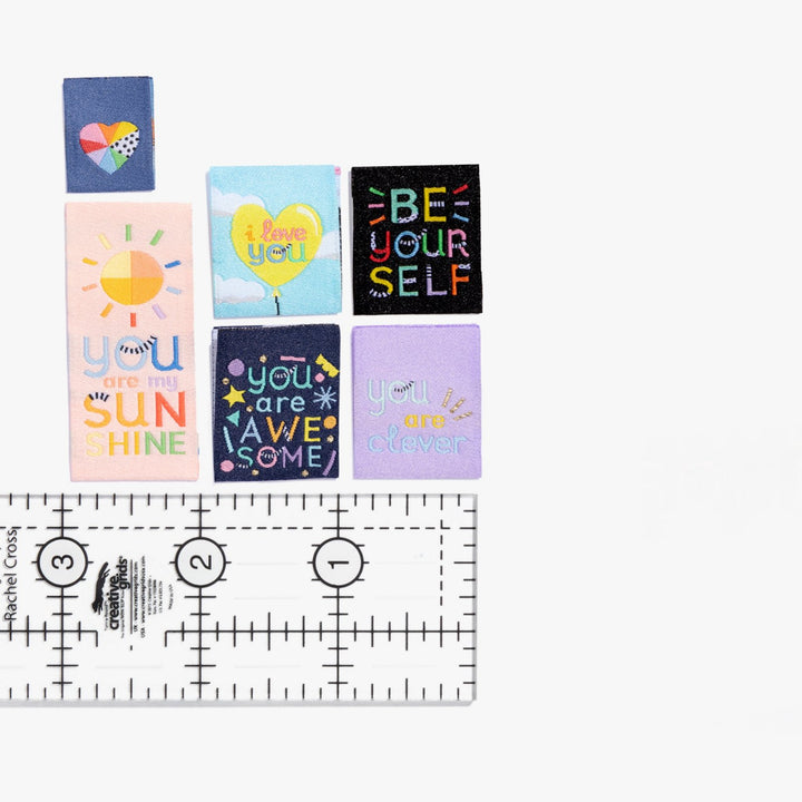 Kylie and the Machine Going Places kids’ labels by Brook Gossen – colorful woven tags and stickers with positive affirmations