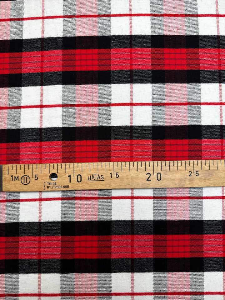 Italian cotton flannel fabric in large white, black, and red plaid, lightweight textile ideal for shirts, blouses, and casual wear.