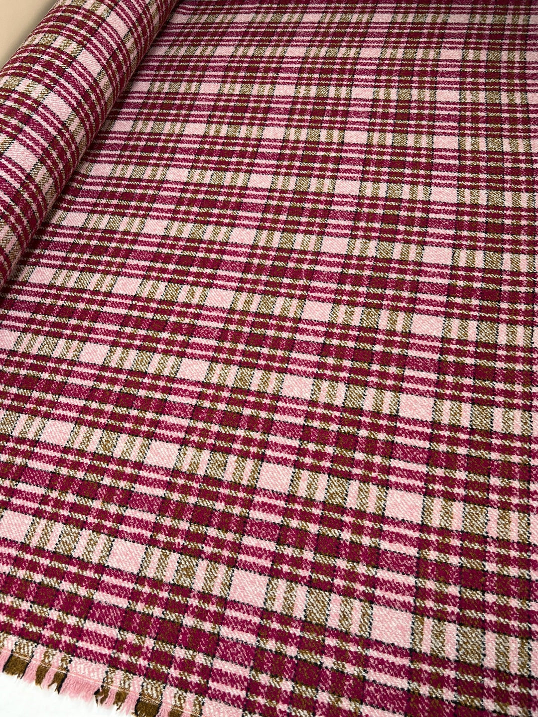 Italian bouclé suiting fabric in beige and pink plaid, medium-heavy acrylic polyamide blend, ideal for structured coats, skirts, and tailored suits.
