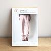 Made by Rae Luna Pants sewing pattern with tapered leg, inseam pockets, and loose comfortable fit in multiple fabrics