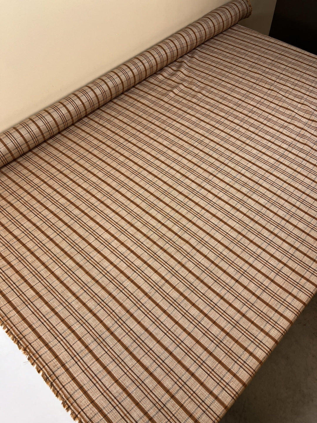 Italian plaid tweed fabric in browns and beige, viscose cotton blend, lightweight textile for structured coats, suiting, skirts, and dresses.