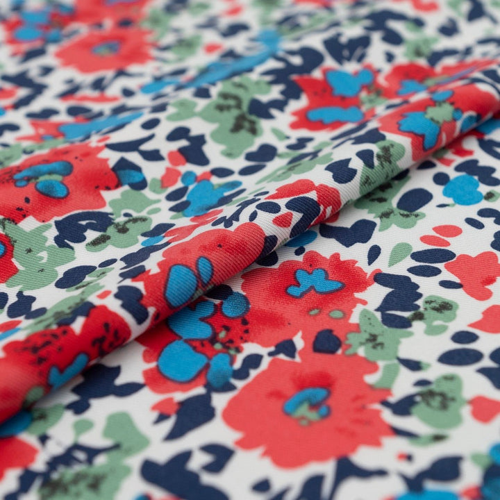 Rayon Taylor Twill Bold Garden fabric – lightweight rayon twill with vibrant floral print on white base for dresses and blouses