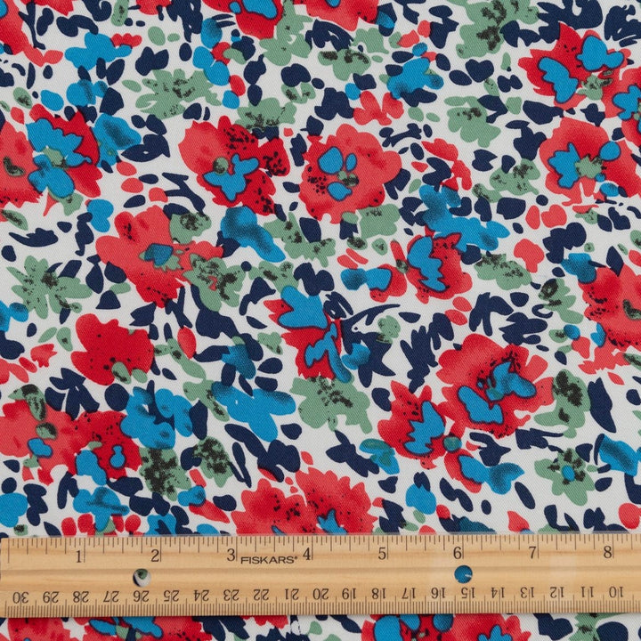 Rayon Taylor Twill Bold Garden fabric – lightweight rayon twill with vibrant floral print on white base for dresses and blouses
