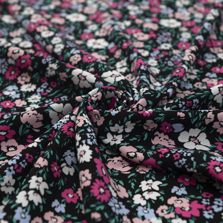 Rayon Challis fabric in Black Night Floral with pastel blooms, 54-inch wide, lightweight and flowy.