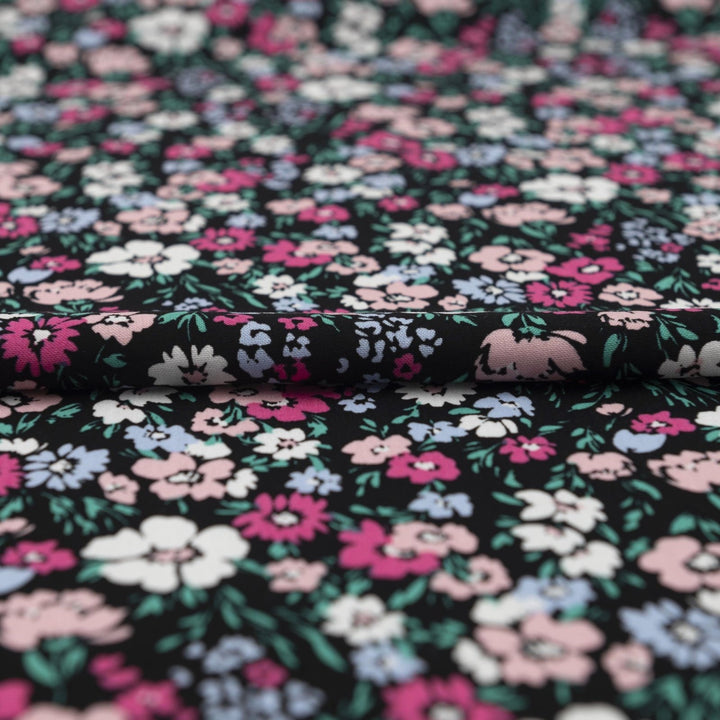 Rayon Challis fabric in Black Night Floral with pastel blooms, 54-inch wide, lightweight and flowy.