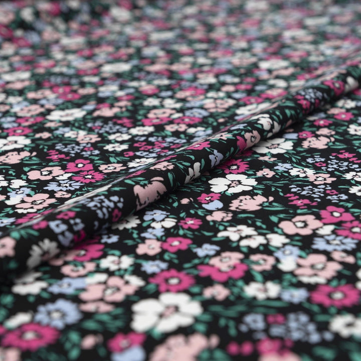 Rayon Challis fabric in Black Night Floral with pastel blooms, 54-inch wide, lightweight and flowy.