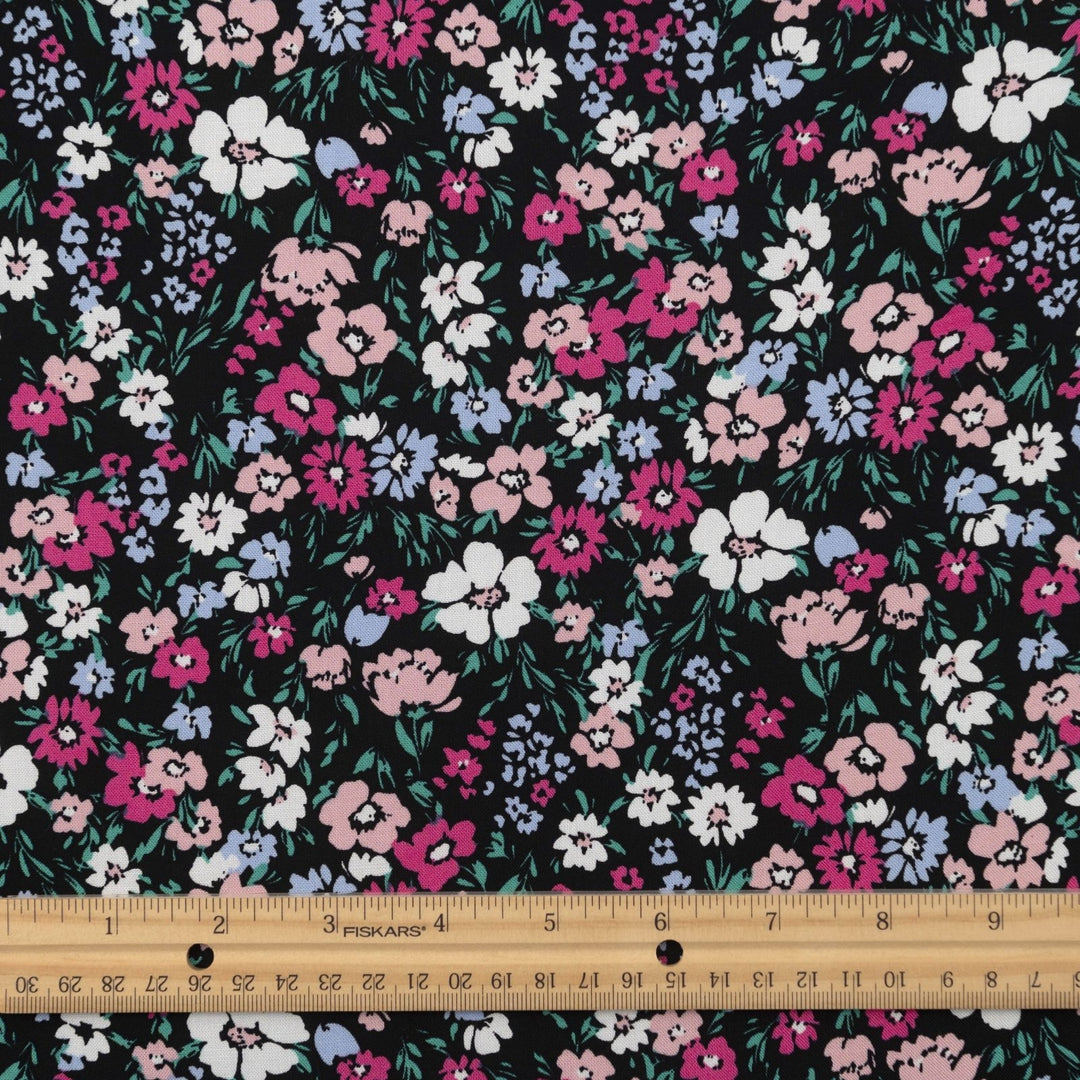 Rayon Challis fabric in Black Night Floral with pastel blooms, 54-inch wide, lightweight and flowy.
