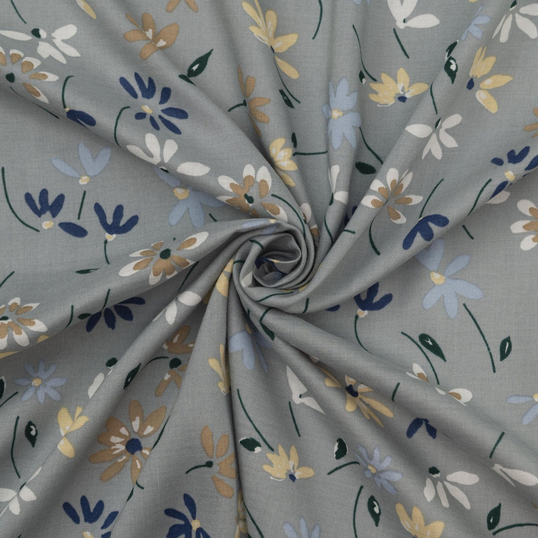 Rayon Challis fabric pale blue with delicate daisy floral print, lightweight and drapey