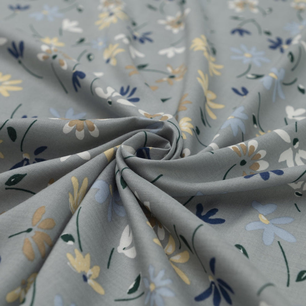 Rayon Challis fabric pale blue with delicate daisy floral print, lightweight and drapey