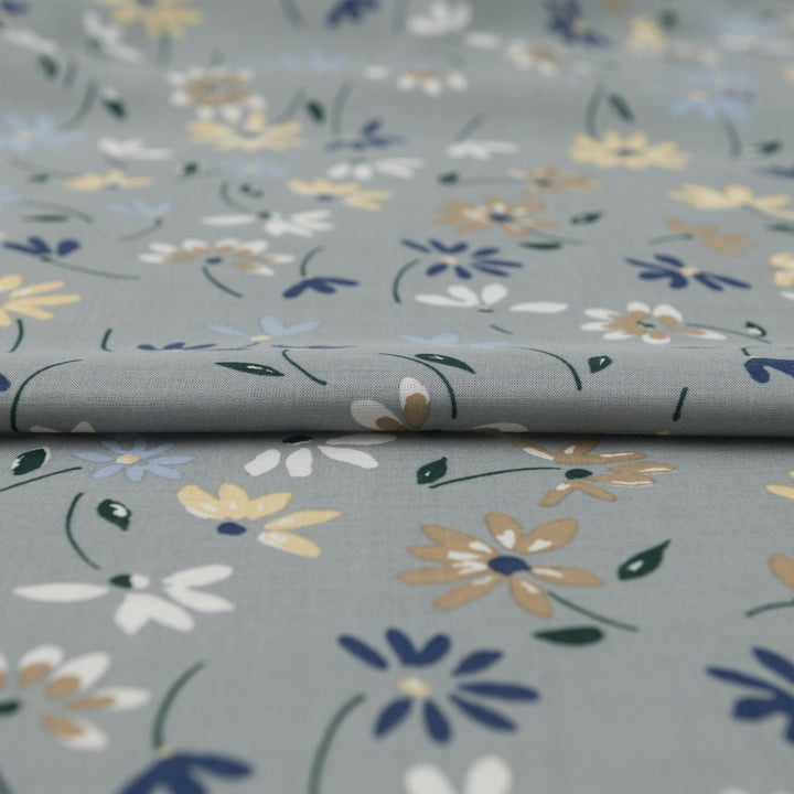 Rayon Challis fabric pale blue with delicate daisy floral print, lightweight and drapey