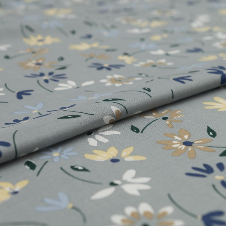 Rayon Challis fabric pale blue with delicate daisy floral print, lightweight and drapey