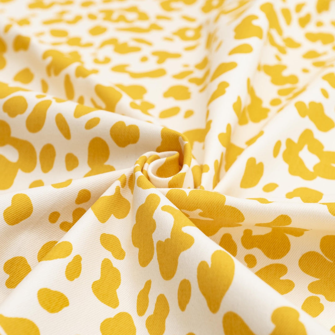 Twill Sunny Splotches cotton spandex fabric with yellow splotches for jackets and skirts