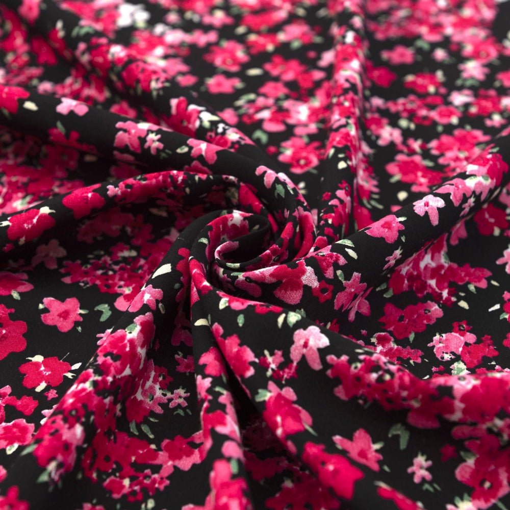 Rayon Challis Midnight Garden fabric with black base and vibrant red pink floral print, 54-inch width, lightweight woven textile