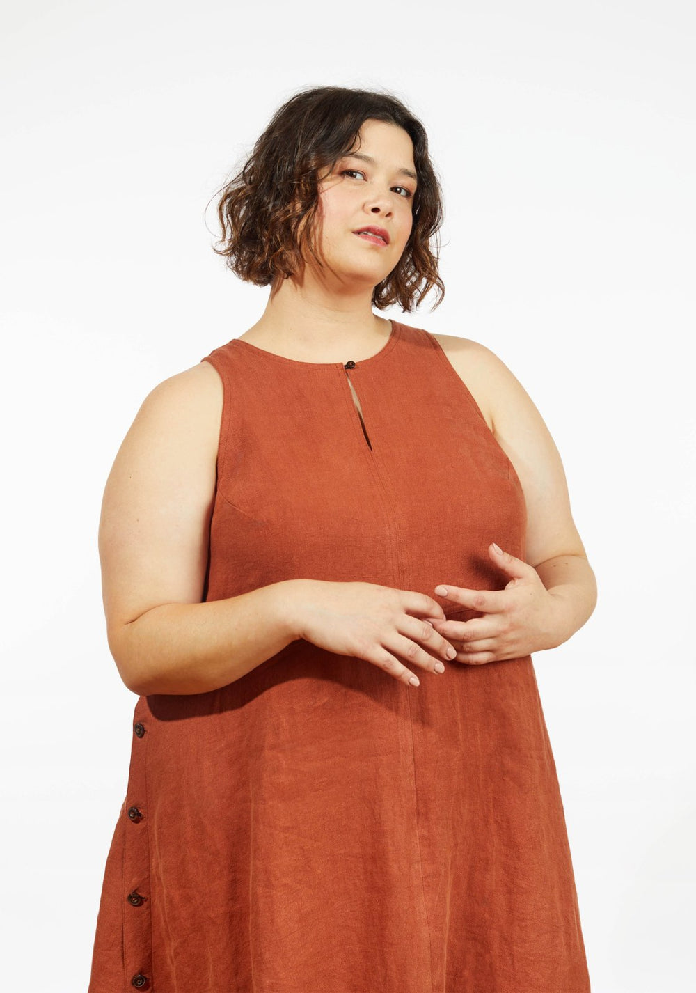 Grainline Studio Austin Dress sewing pattern for sizes 14–32 with sleeveless design, side button closures, and customizable skirt options