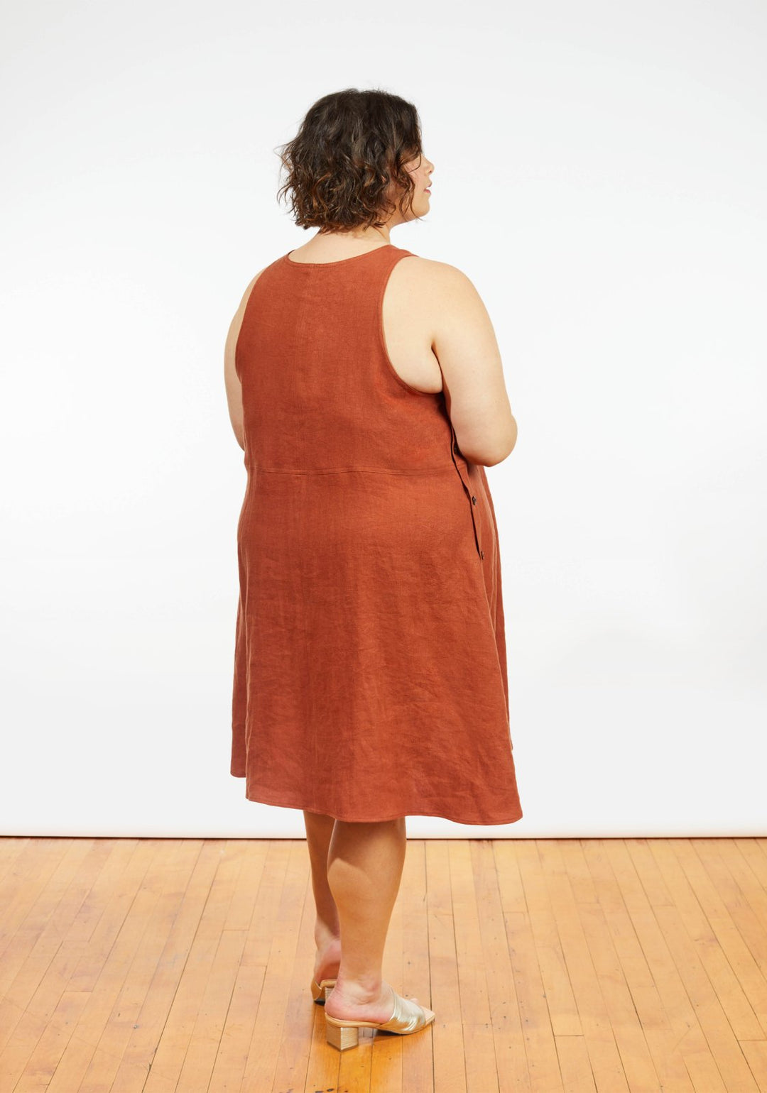 Grainline Studio Austin Dress sewing pattern for sizes 14–32 with sleeveless design, side button closures, and customizable skirt options