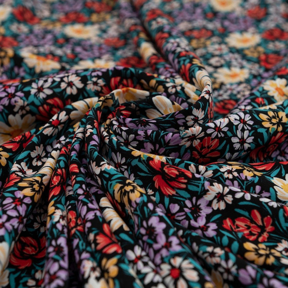 Rayon Crepe Noir Garden Medley fabric – 100% rayon, 56 inches wide, black floral deadstock fabric for dresses, blouses, and skirts