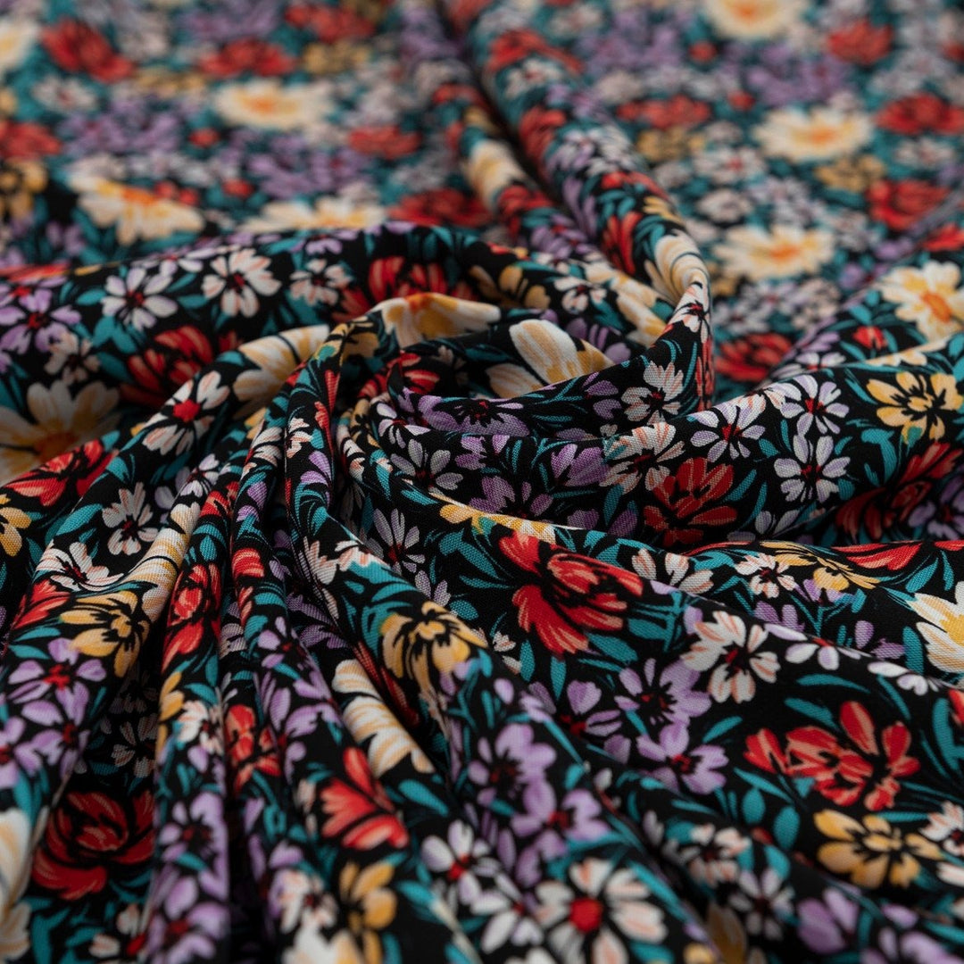 Rayon Crepe Noir Garden Medley fabric – 100% rayon, 56 inches wide, black floral deadstock fabric for dresses, blouses, and skirts