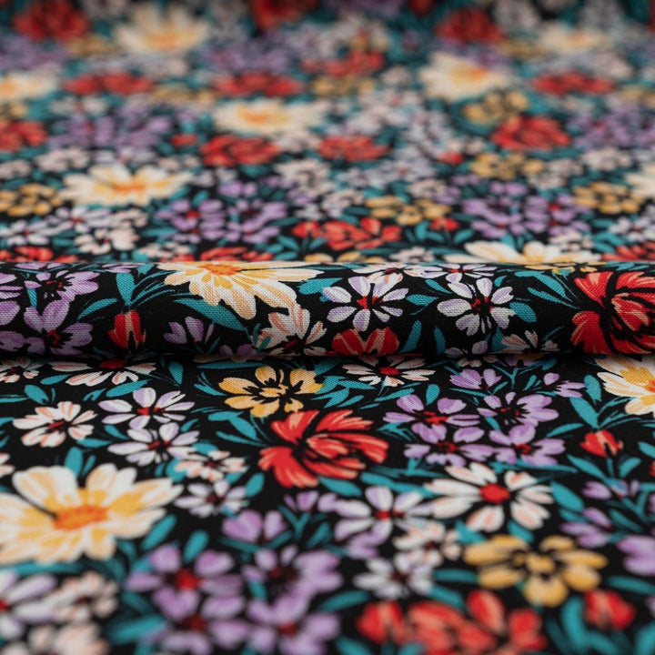 Rayon Crepe Noir Garden Medley fabric – 100% rayon, 56 inches wide, black floral deadstock fabric for dresses, blouses, and skirts