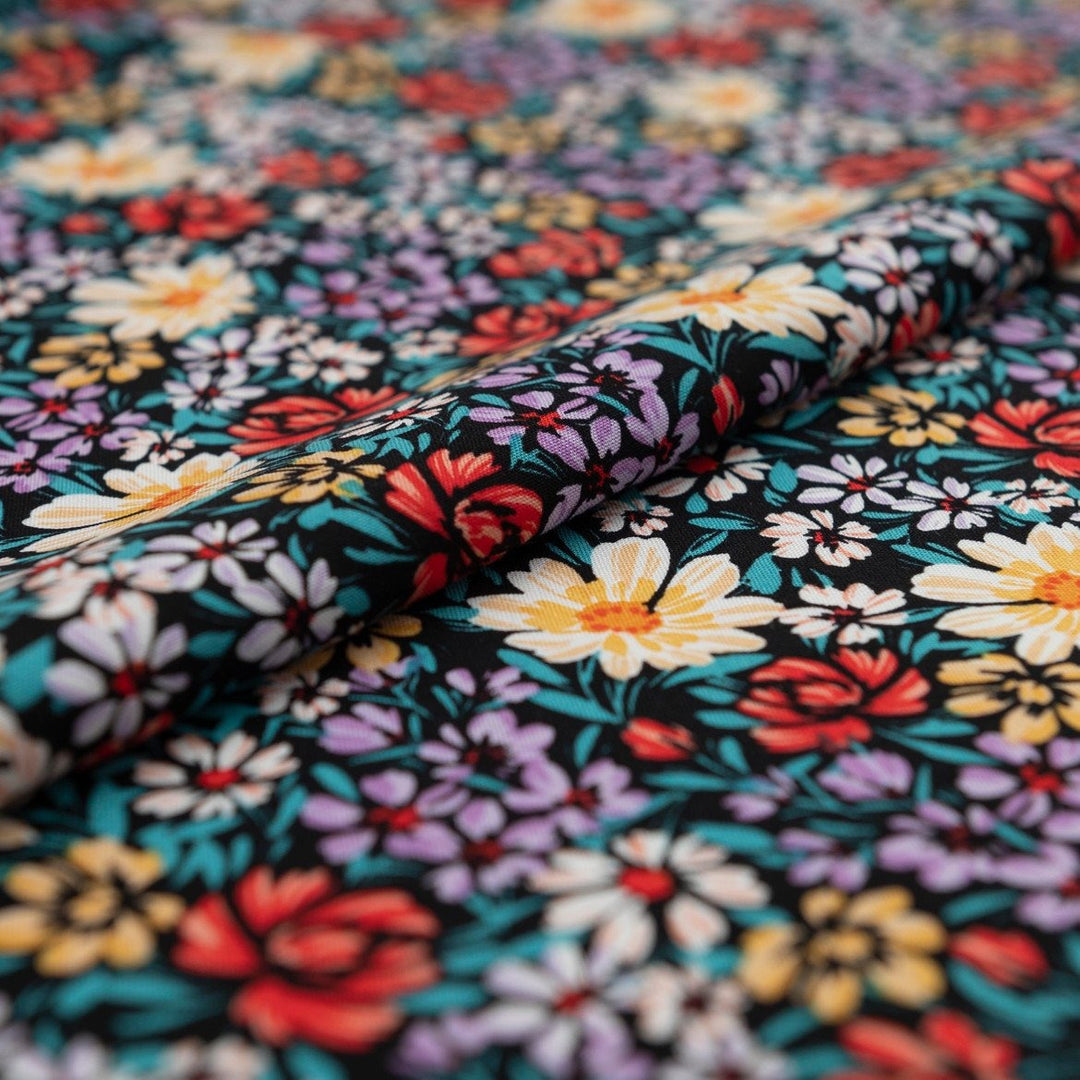 Rayon Crepe Noir Garden Medley fabric – 100% rayon, 56 inches wide, black floral deadstock fabric for dresses, blouses, and skirts