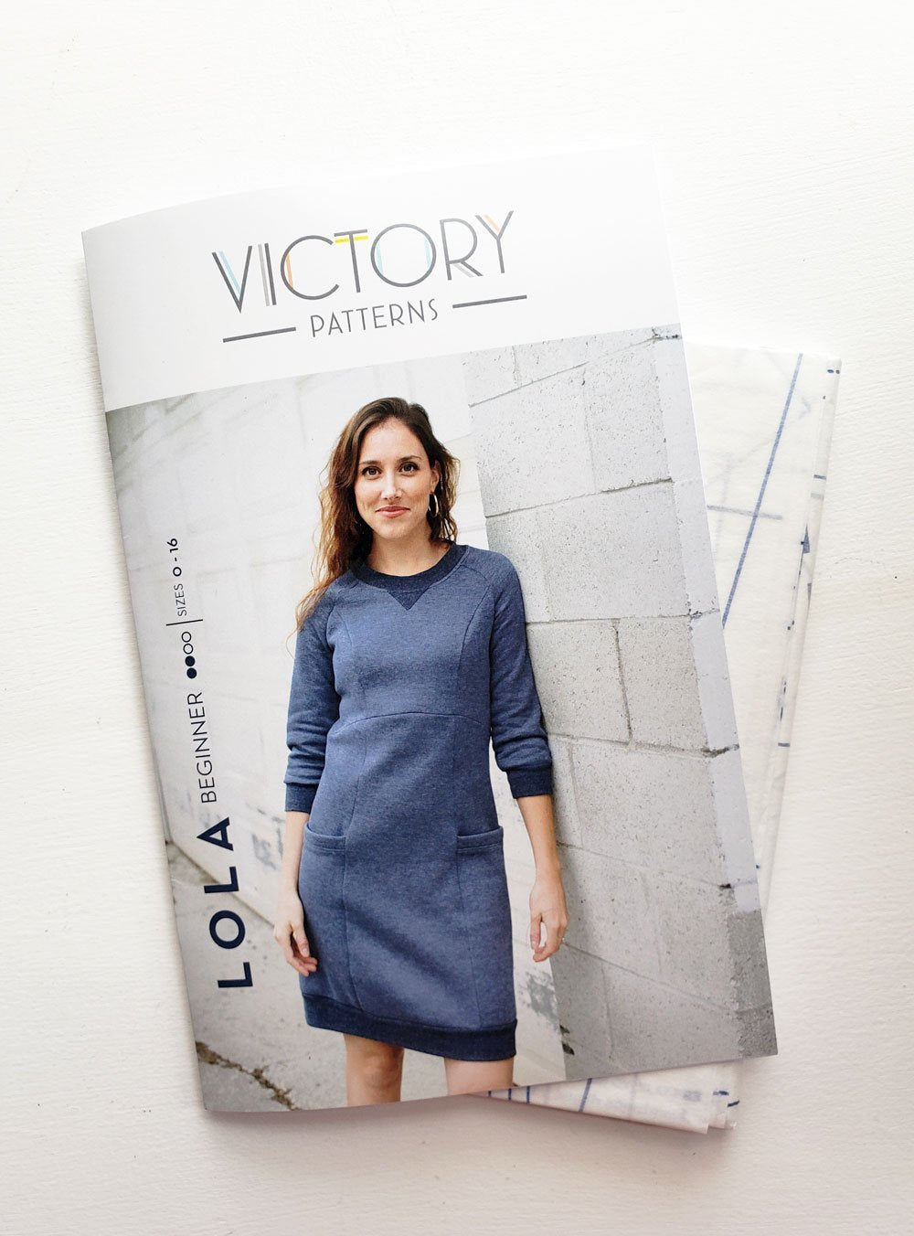 Victory Patterns Lola slip-on sweater dress with raglan sleeves, princess seams, oversized pockets, and ribbed neckline, hem, and cuffs