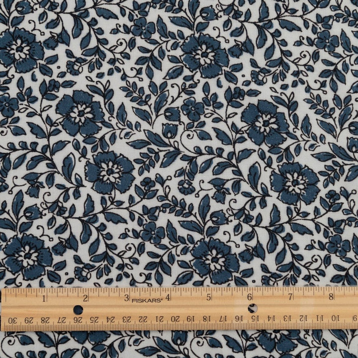 Rayon Challis Indigo Blossom Breeze fabric with indigo floral outline on white background, lightweight and soft drape textile for dresses, blouses, and skirts