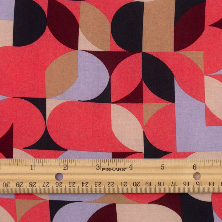 Viscose Challis "Kaleidoscope Bright" fabric featuring vibrant geometric shapes in pink, purple, black, and taupe, 58-inch width, perfect for dresses and summer garments