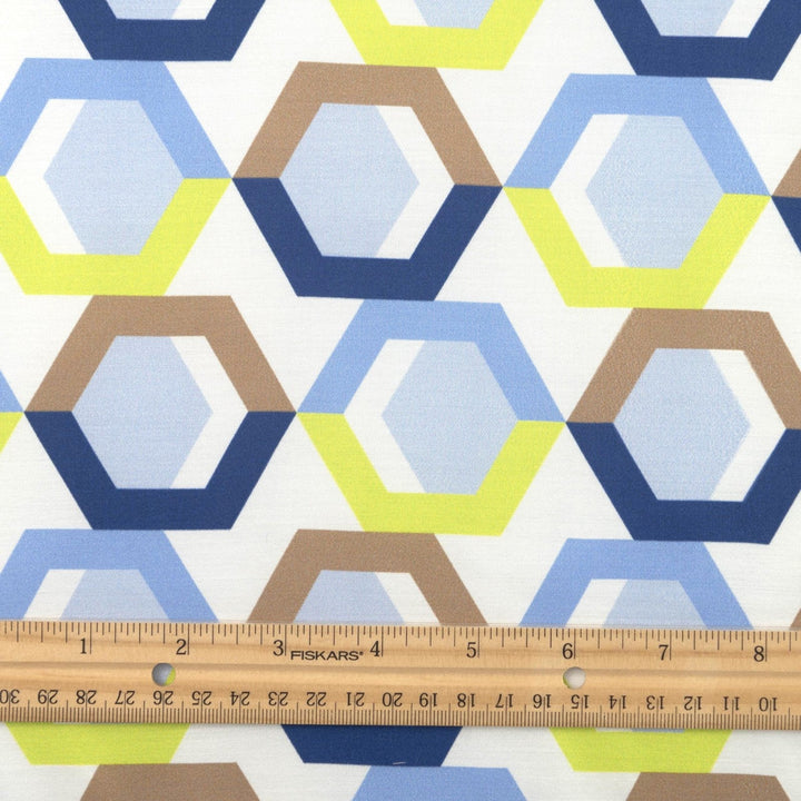 Viscose Sateen Prism Play fabric with geometric shapes in white, blue, and green, luxurious smooth drape and subtle sheen