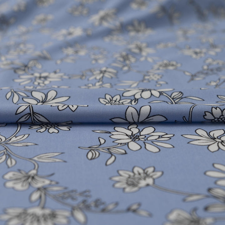 Rayon Challis Blooms on Porcelain Blue fabric, soft pastel floral print, 54 inches wide, lightweight sewing material for dresses and blouses