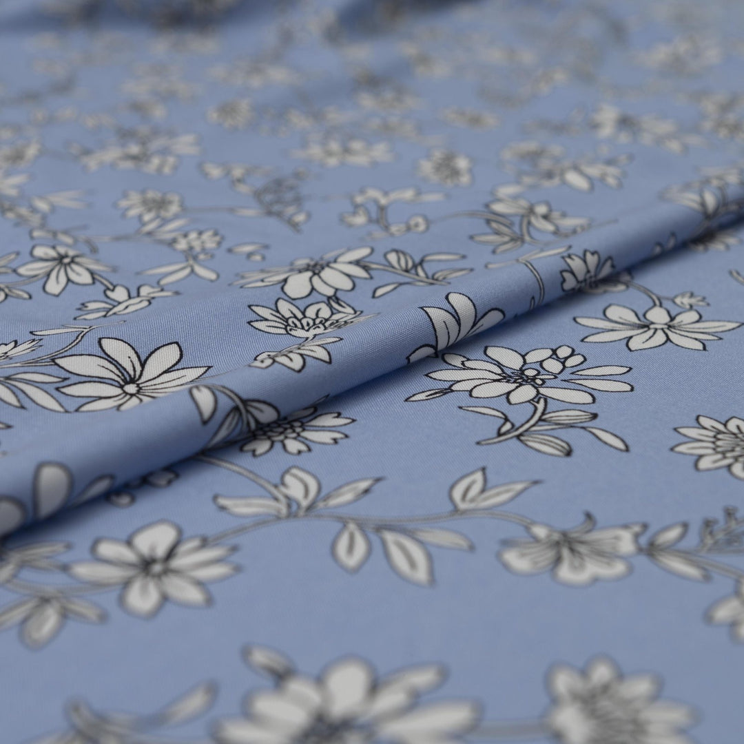 Rayon Challis Blooms on Porcelain Blue fabric, soft pastel floral print, 54 inches wide, lightweight sewing material for dresses and blouses