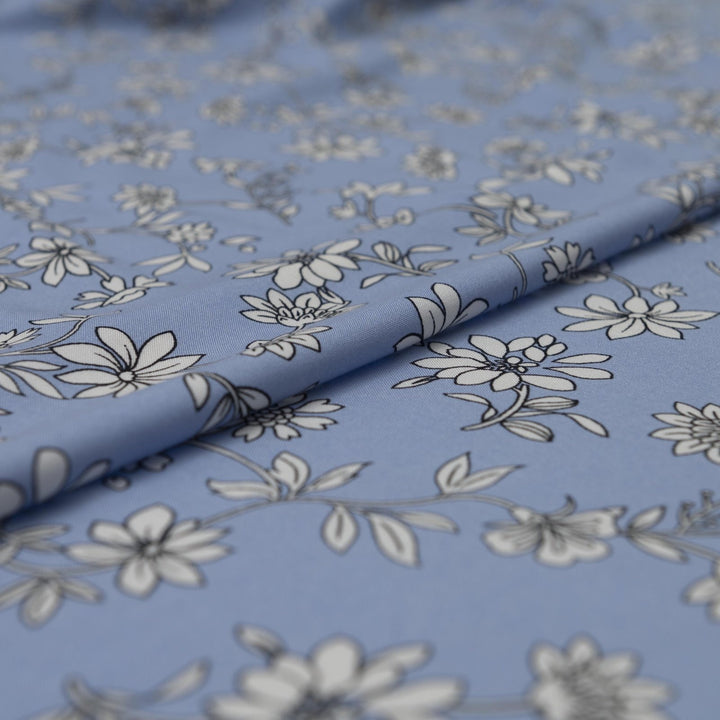 Rayon Challis Blooms on Porcelain Blue fabric, soft pastel floral print, 54 inches wide, lightweight sewing material for dresses and blouses