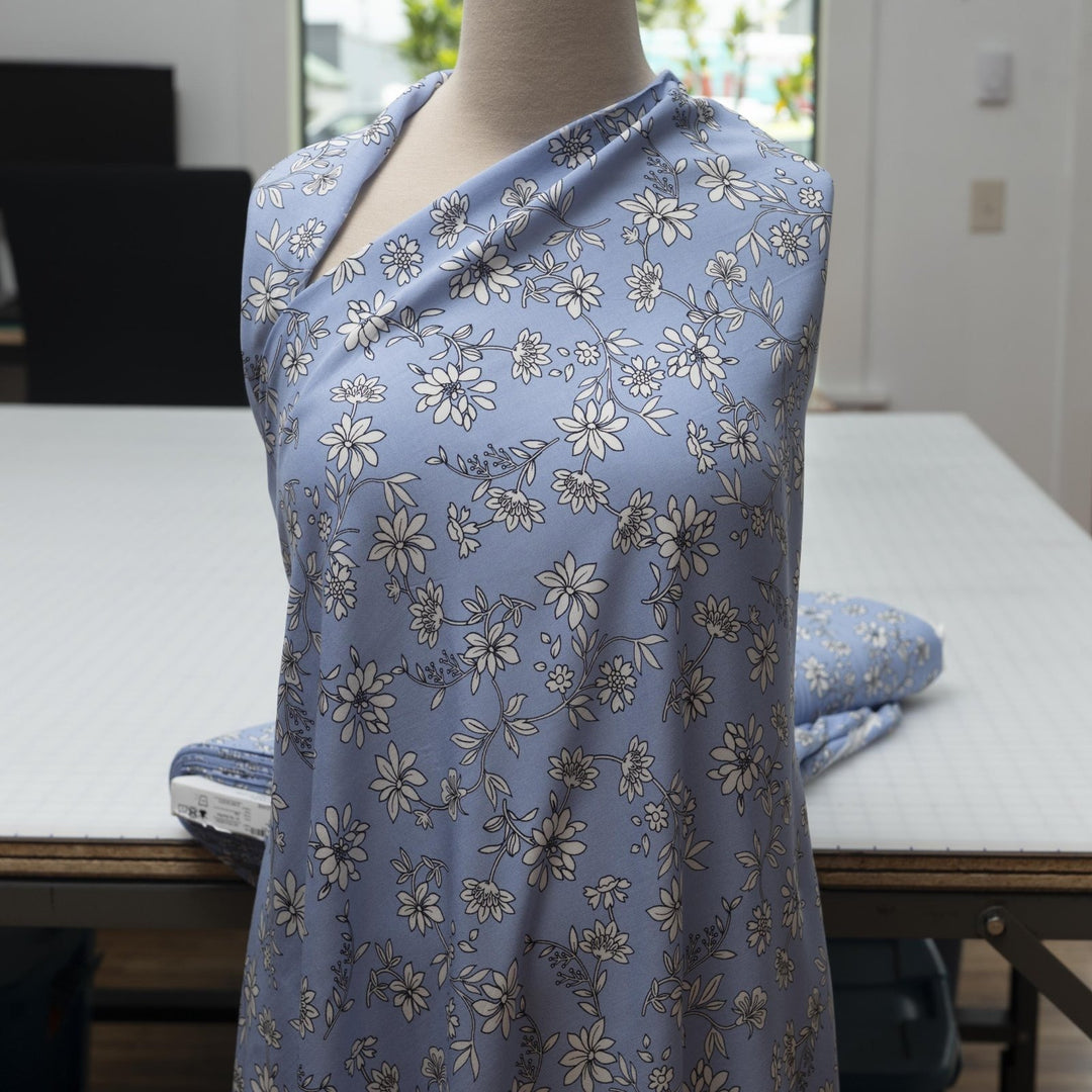 Rayon Challis Blooms on Porcelain Blue fabric, soft pastel floral print, 54 inches wide, lightweight sewing material for dresses and blouses