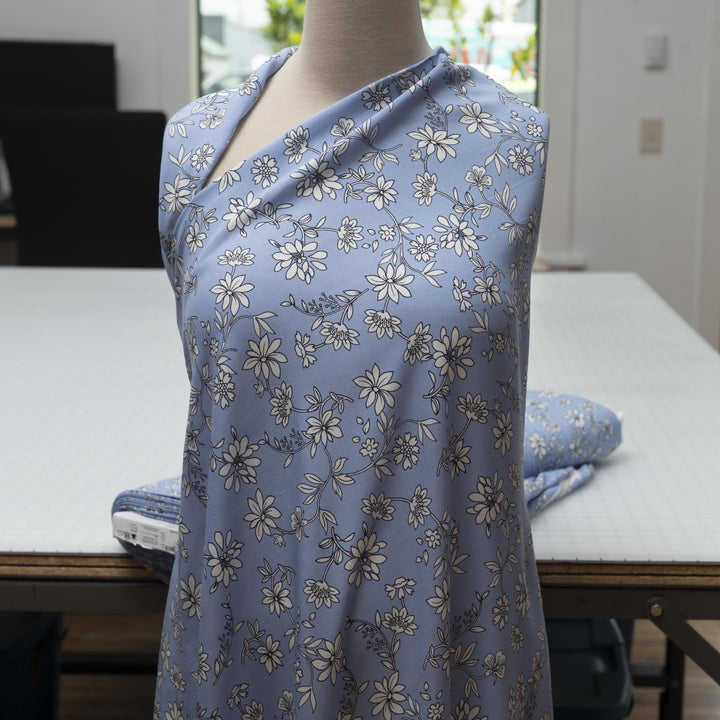 Rayon Challis Blooms on Porcelain Blue fabric, soft pastel floral print, 54 inches wide, lightweight sewing material for dresses and blouses