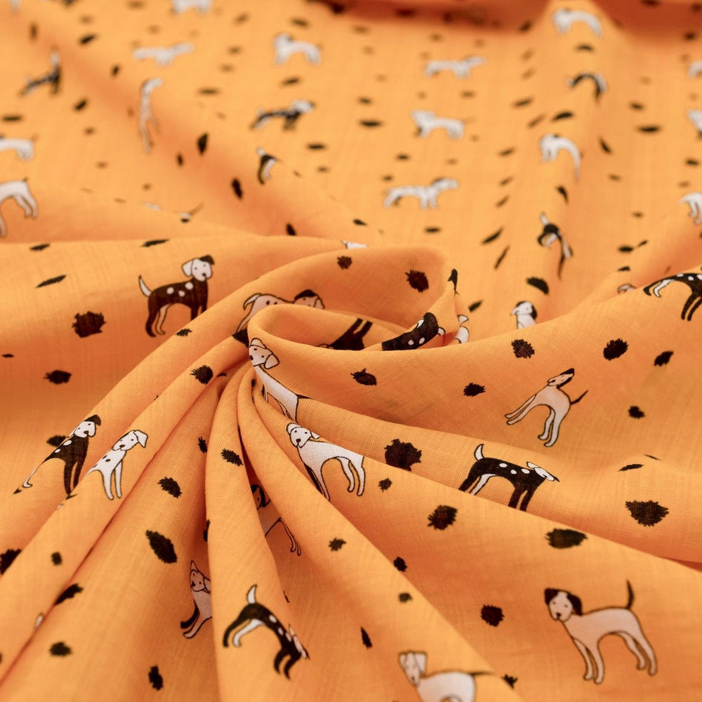 Rayon Cotton Voile fabric with playful black and white puppy print on sunshine yellow background, 50% rayon 50% cotton, 140cm width