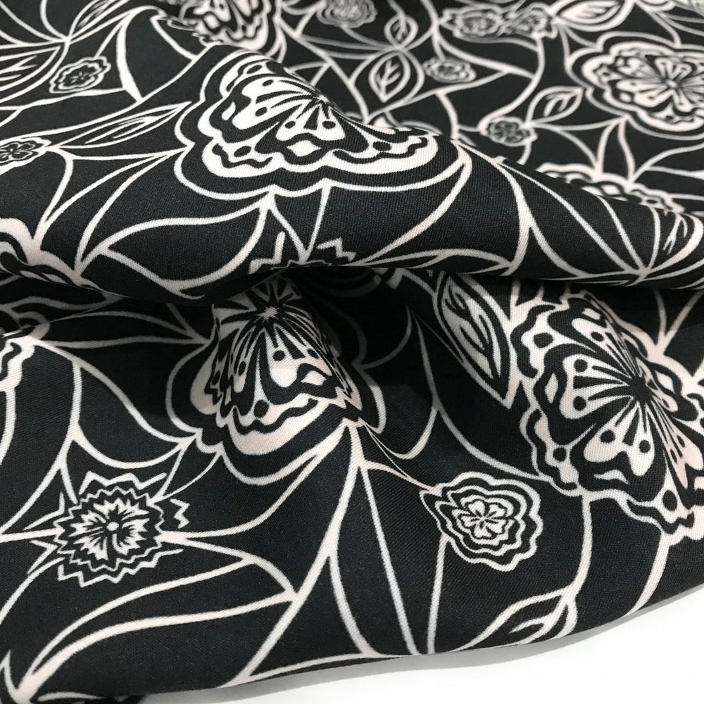 Organic Tencel Twill Rowdy Patch Black fabric with whimsical digital print, eco-friendly GOTS-certified inks, fluid drape, and luxury twill texture